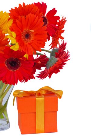 gerbera fresh  flowers in glass vase with gift box  isolated on white backgroundの写真素材