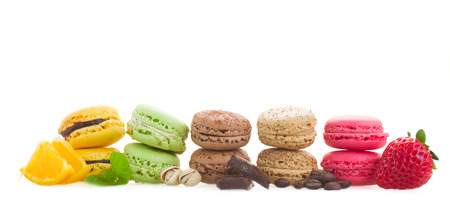 row of french macaroons with ingredients  isolated on white background