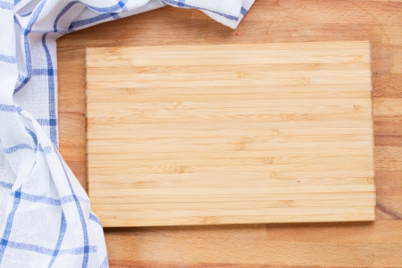 empty wooden cutting board  and cloth blue  napkinの写真素材