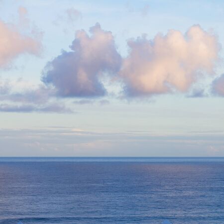 beautiful seascape with deep  ocean  waters and cloudscape at sunrise