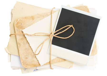 pile of old mail and aged photos  isolated on white の写真素材