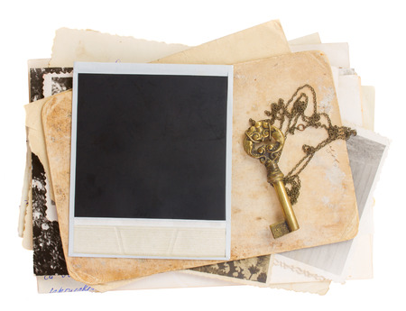 pile of old papers with key   isolated on white の写真素材