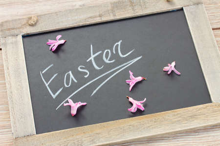 White easter letters on black chalkboardの写真素材