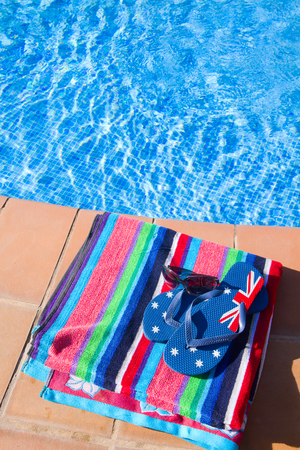 towel and sandal  near pool  blue waterの写真素材