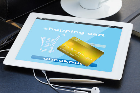 mobile shopping concept  - checking out in virtual shop on tablet PCの写真素材