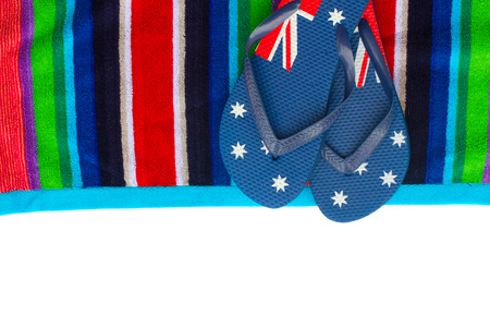 sandals on beach  towel border isolated on white backgroundの写真素材