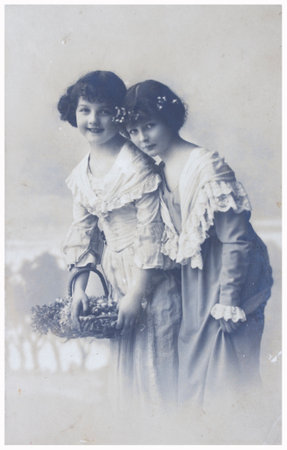 POLAND, WARSAW - CIRCA 1915: old photo of two young girls. Illustrative Image, subject of human...