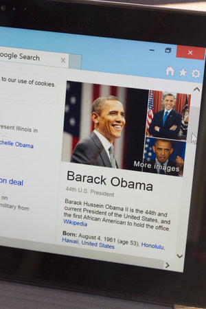 WARSZAWA, POLAND - OCTOBER 10, 2014.  Barack Obama WiKi page on screen of tablet.