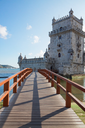 bridge to Torre of Belem at sunny day, famouse landmark of Lisbon, Portugalの写真素材
