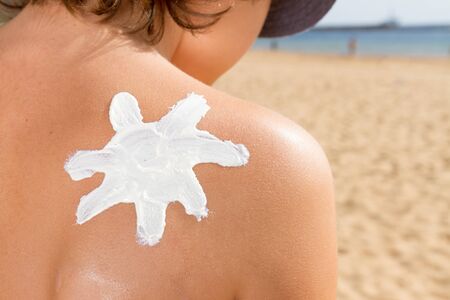 sun lotion on shoulder