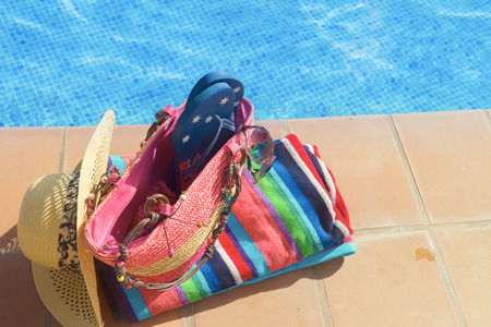 towel and bathing accessories near pool
