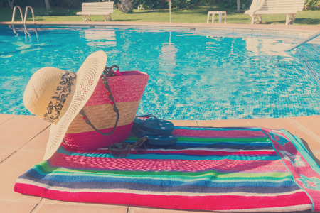towel and bathing accessories near poolの写真素材