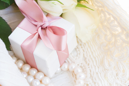 Pink and orange roses with laceの写真素材