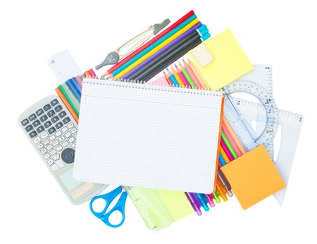 Blank ruled notebook with school supplies isolated on white background