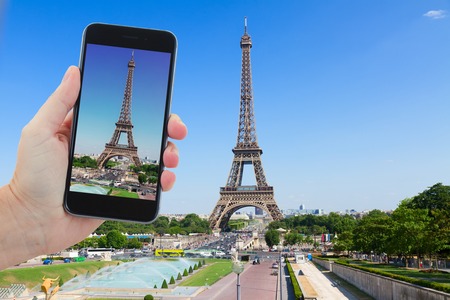 travel concept with  Eiffel Tower  and Paris cityscape in summer sunny day, France
