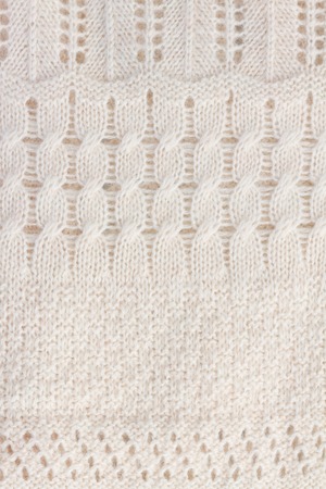texture of white knitted soft sweater background, vertical image