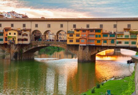 famous bridge Ponte Vecchio at sunset, Florence, Italyの写真素材