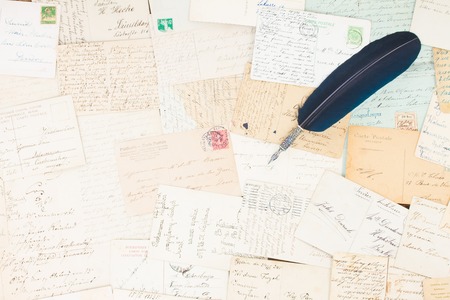 Set of handwritten antique letters with blue feather pen vintage backgroundの写真素材