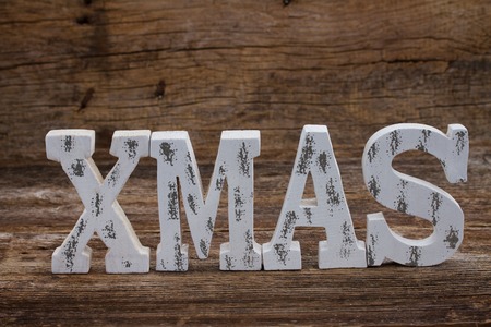 Xmas white aged word on wooden backgroundの写真素材