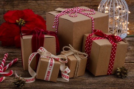 Handmade gift boxes on wooden background with lights