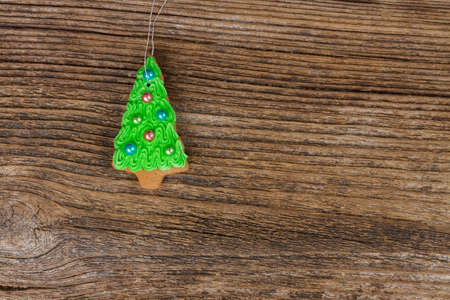 christmas gingerbread evergreen tree cookies on wooden backgroundの写真素材