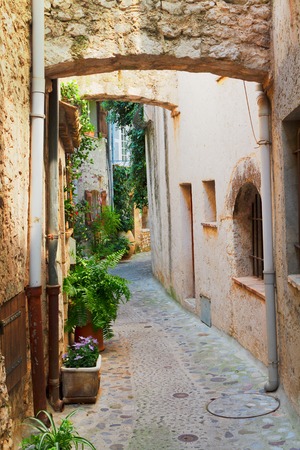 narrow medieval town street of Provence at summer day, Franceの写真素材