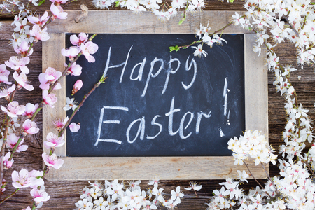 Happy easter words with pink cherry flowersの写真素材