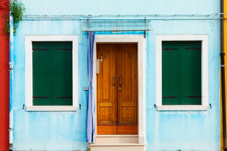 blue typical house facade of Burano island, Venice, Italyの写真素材