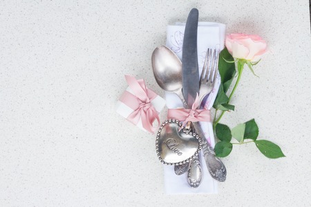 Valentines day dinner concept with vintage silver cutleryの写真素材