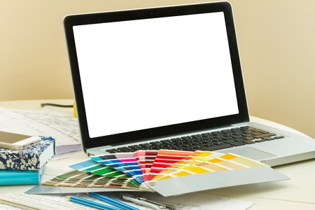 designer's working table - open notebook with  colour chartsの写真素材