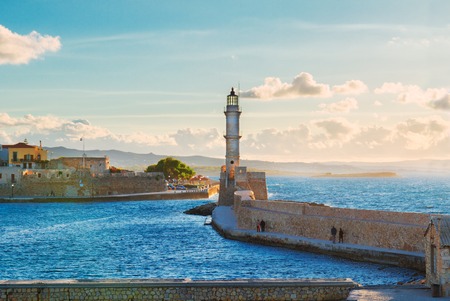 bay of Chania with sea and lighthouse at sunny summer sunset, Crete, Greeceの写真素材
