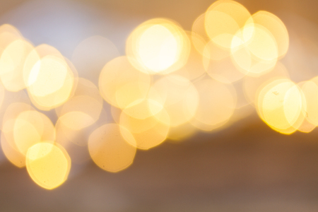 christmas pale yellow lights bokeh defocused backgroundの写真素材