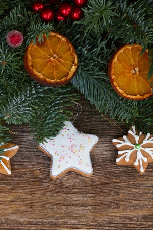christmas gingerbread cookies with decorated fir treeの写真素材