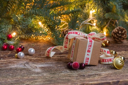 Handmade gift boxe on wooden background with christmas lights in background