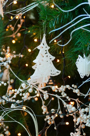christmas tree with white holiday decorations and lightsの写真素材
