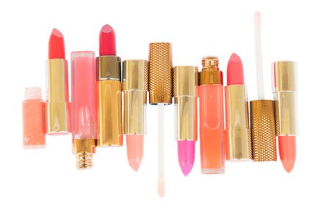 Collection of colorful pink and red lipsticks isolated on white backgroundの写真素材