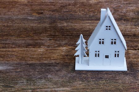 White christmas house on wooden texture background backgroundの写真素材