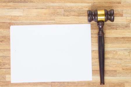 Wooden Law Gavel, empty note paper on wooden tableの写真素材