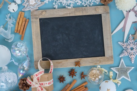 Blue and white christmas - styled christmas frame flat lay style with copy space on chalk blackboardの写真素材