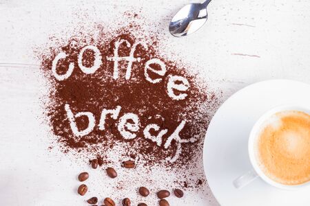 coffee break concept - cup of espresso and coffee break letteringの写真素材