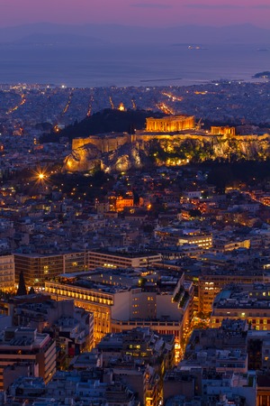 cityscape of Athens with Acropolis hill, Pathenon and sea at night, Greeceの写真素材
