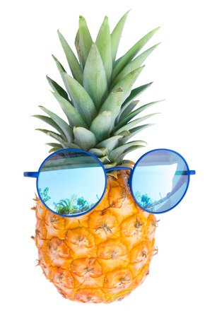 Pinapple in sunglasses isolated on white backgroundの写真素材