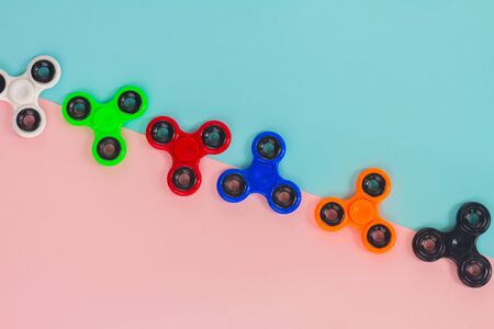 trendy fidget spinners - styled pop art flat lay scene with generic design spinnersの写真素材