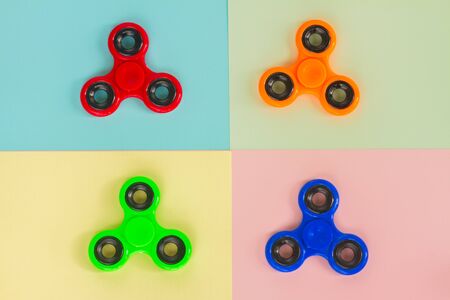 trendy fidget spinners - styled pop art flat lay scene with set of generic design spinnersの写真素材