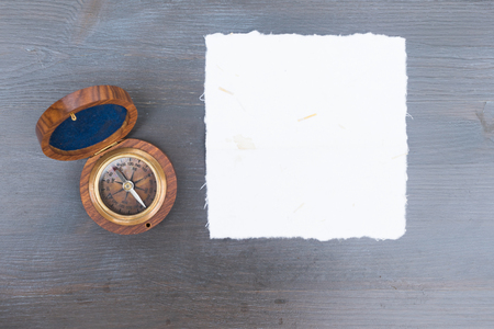 Old vintage compass, copy space on white paperの写真素材