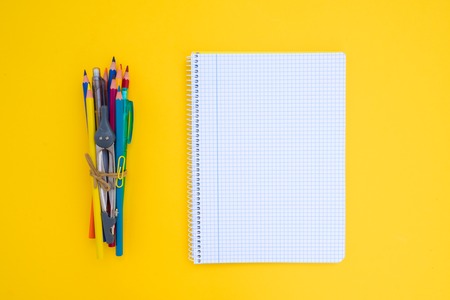 back to school concept minimalistic and creative scene with copy space on empty sheet on yellow...