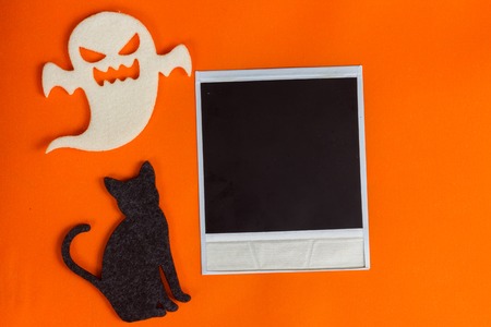 Halloween scene on orange background, copy space on vintage photo