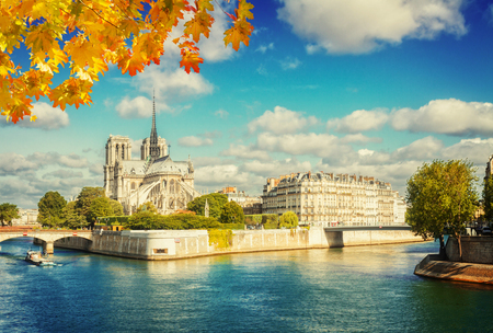 Notre Dame cathedral church, Site island and Seine at fall day, Paris, France, retro tonedの写真素材