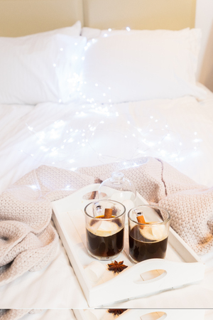 Breakfast in bed for two - tray with cup of coffee and sweet marshmallows, cozy winter hygge home styleの写真素材