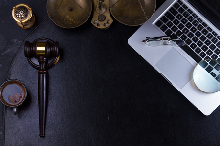 Workspace hero header with law gavel and laptop keyboard, top view, copy space on desktopの写真素材